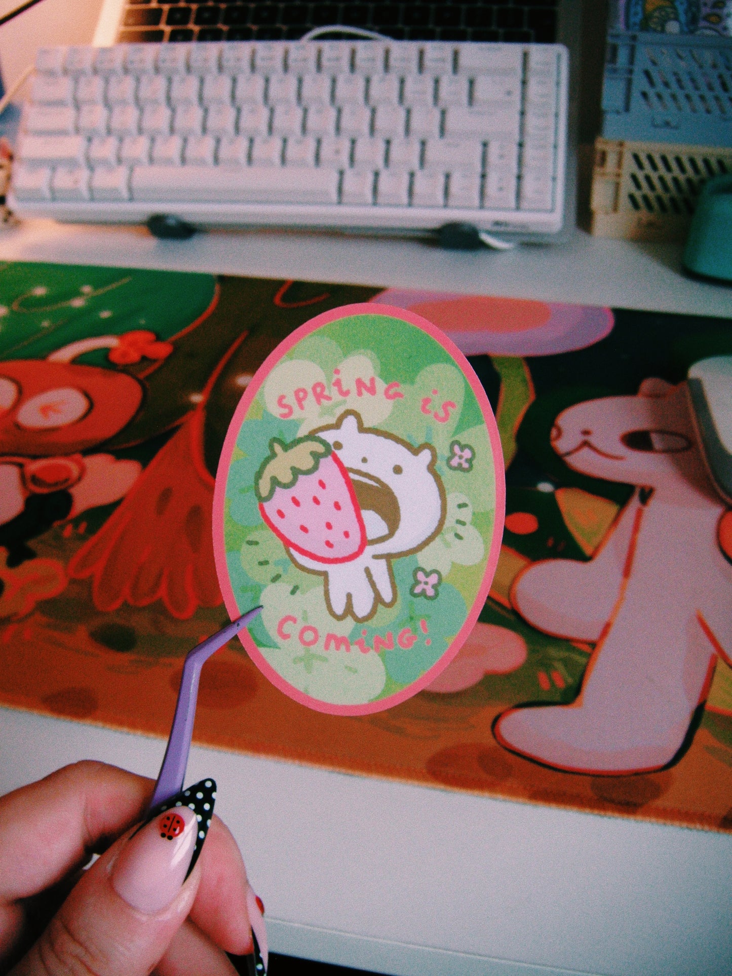 spring is coming with a strawberry in the mouth sticker