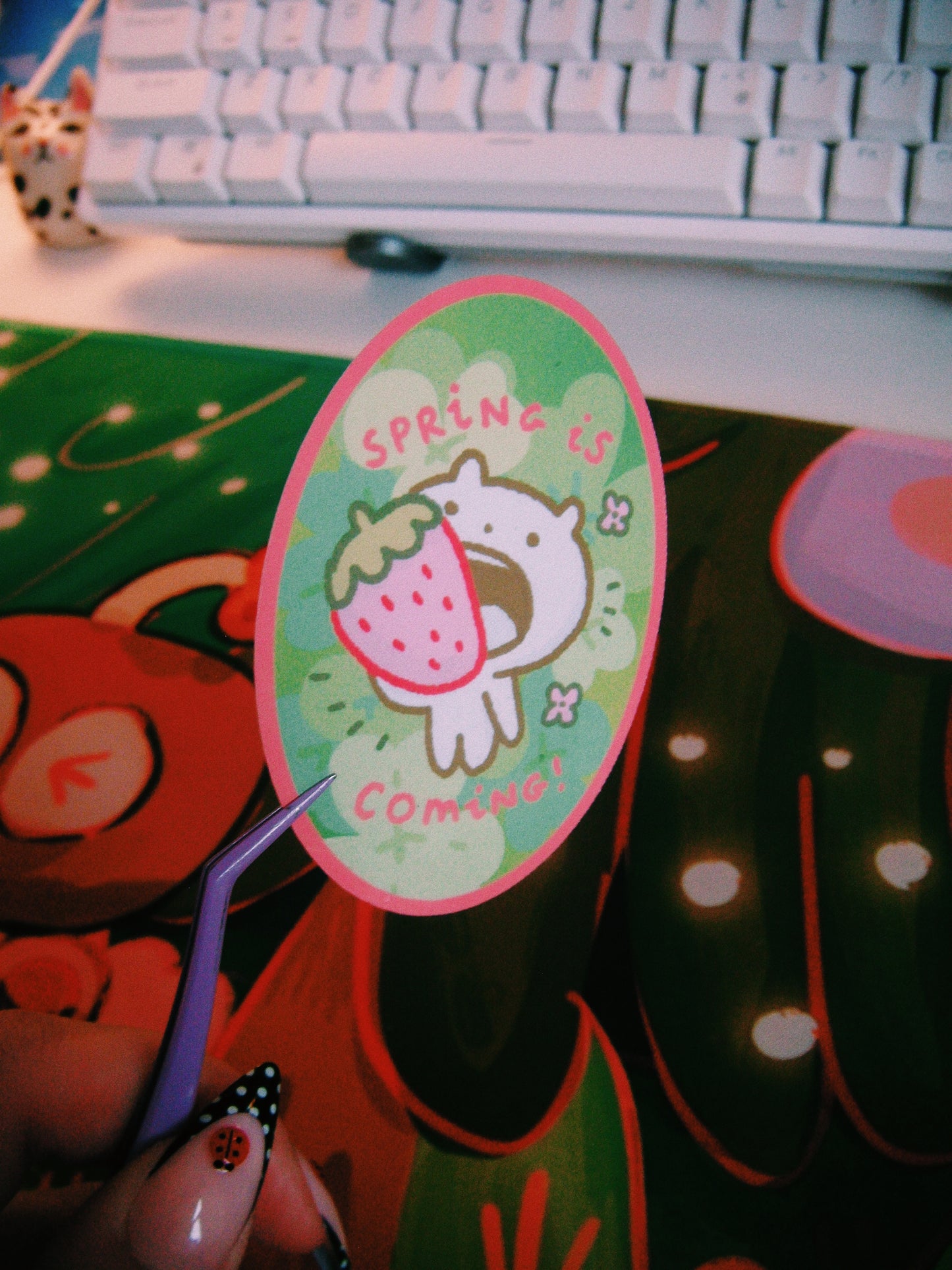 spring is coming with a strawberry in the mouth sticker