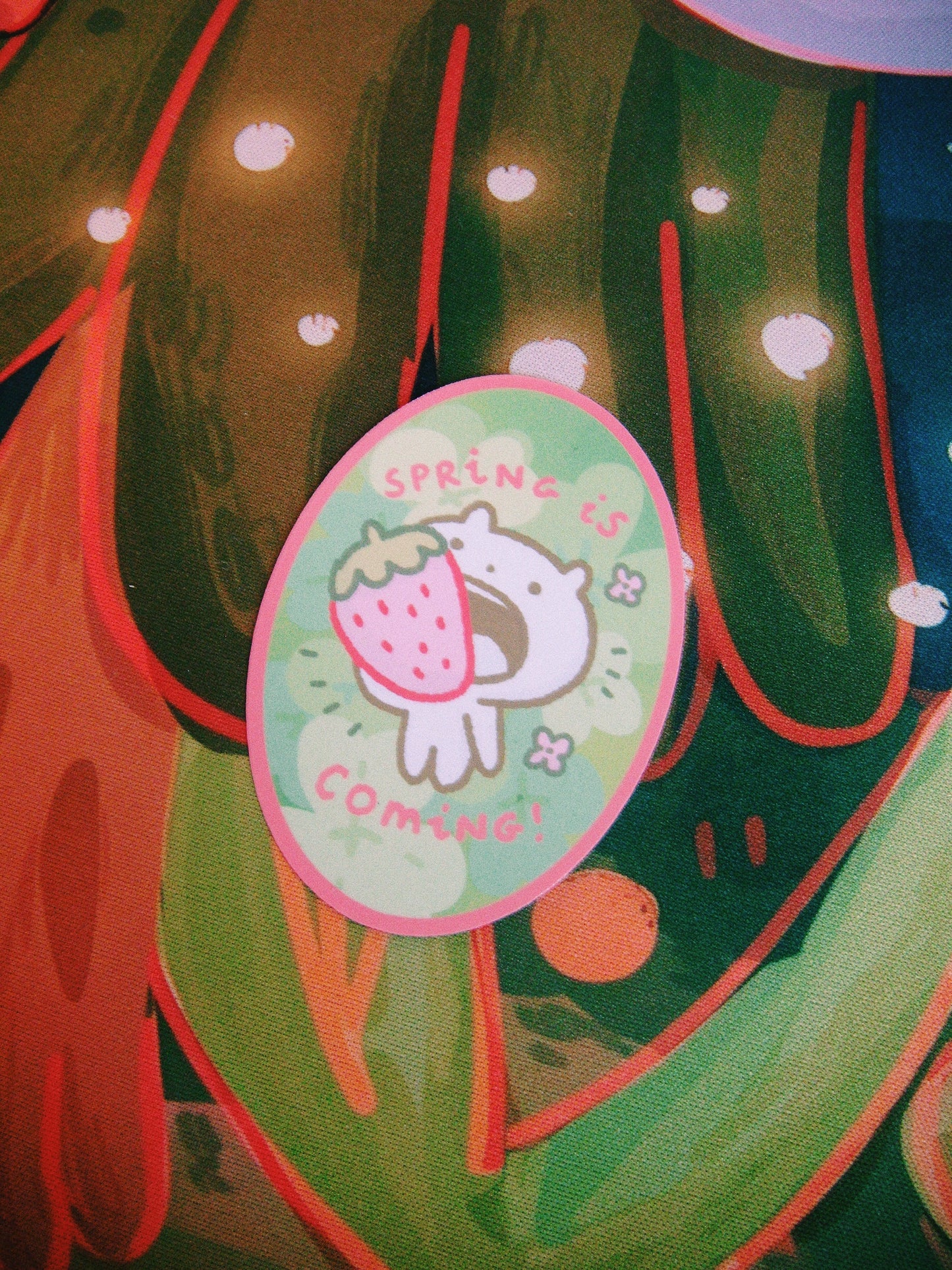 spring is coming with a strawberry in the mouth sticker