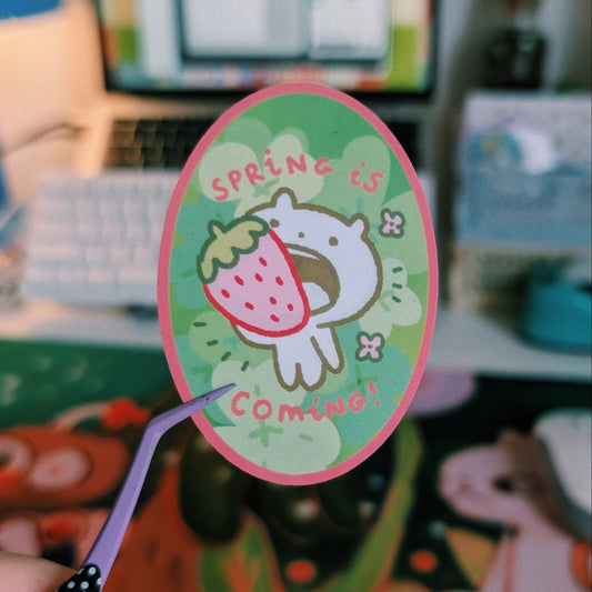 spring is coming with a strawberry in the mouth sticker