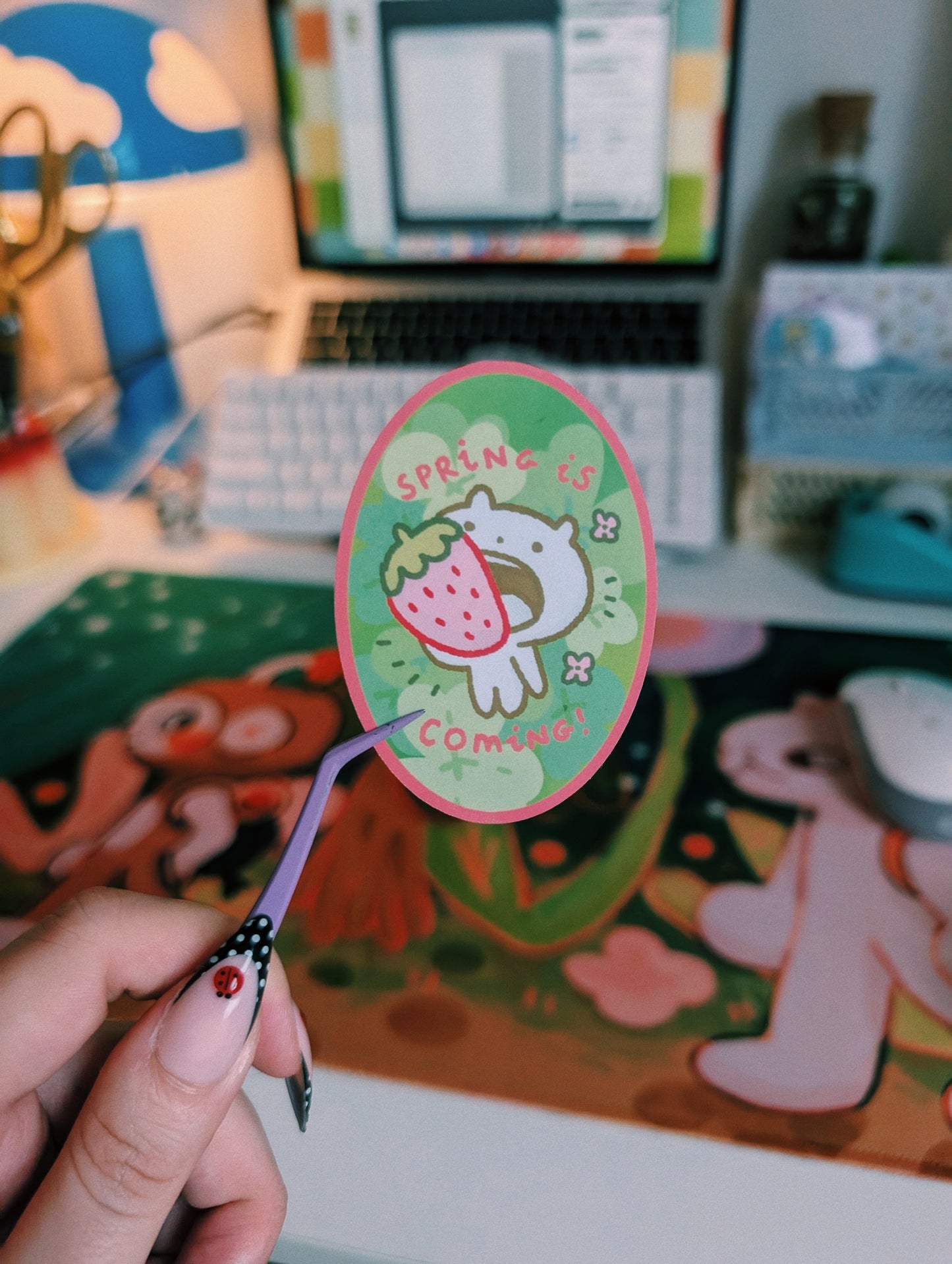 spring is coming with a strawberry in the mouth sticker